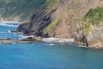 cliffs next to the blue ocean