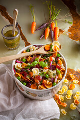 Pata salad with peas, baby carrots and bacon.