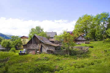 Obraz na płótnie Canvas Wooden house in sunny day in Yaremche, Ukraine 