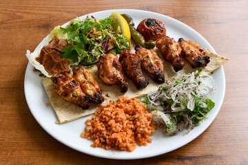 Chicken wings barbeque in a dish with BBQ grill sauce . Izgara tavuk kelebek sis kanat. Tavuk sis, gogus.