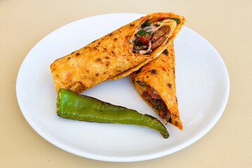 Lavash doner kebab ( zurna doner durum )  or shawarma sliced in plate isolated. 