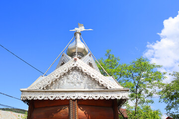 Wooden well with metal coating in Yaremche, Ukraine