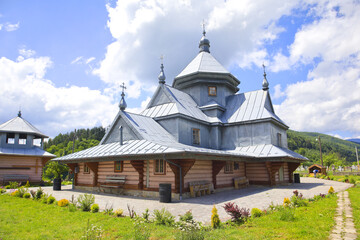 Fototapeta na wymiar Wooden Church of Archstrategist Michael's Church in the village of Dora (suburb of Yaremche), Ukraine 