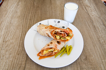 Lavash doner kebab ( zurna doner durum )  or shawarma sliced in plate isolated. 