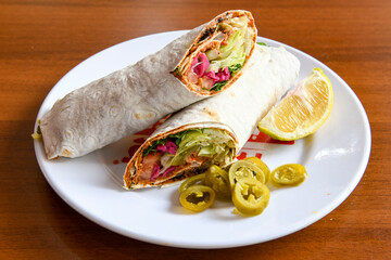 Lavash doner kebab ( zurna doner durum )  or shawarma sliced in plate isolated. 
