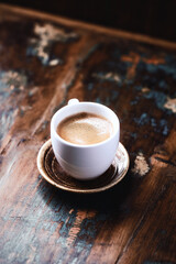 Cup of coffee on rustic wooden background. Close up. Copy space.