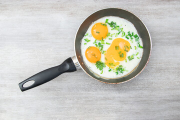 Fried Eggs. Sunny side up or fried eggs. Classic ingredients and garnishes used in restaurant cooking.