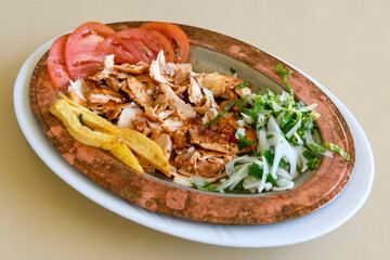 Turkish and Arabic Traditional Ramadan doner kebab with tasty tomato sauce and rice or turkish...