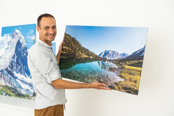 Modern Home Interior And Domestic Decor. a man is holding a photo canvas