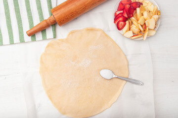 Step by step recipe galette or pie with strawberry. recipe for making biscuits, sweet pastries. Top view with copy space.