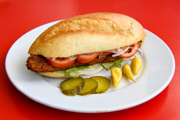 Close-up shot of Izmir's famous Turkish Traditional Kumru Sandwich, Çeşme Kumru, Karisik sandvic,  ingredients ready to eat salami, soudjouk, tomato, cheddar cheese and fried cheese. Yengen sandvic.