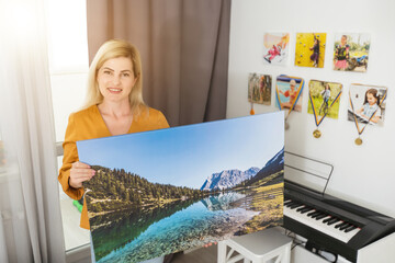 Canvas prints. woman holding photo canvas