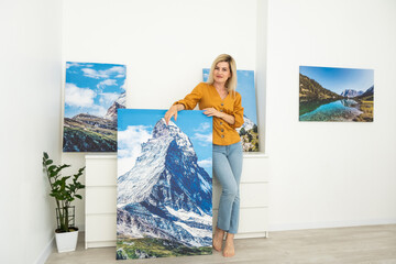 Canvas prints. woman holding photo canvas