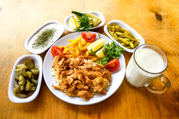 Turkish and Arabic Traditional Ramadan doner kebab with tasty tomato sauce and rice or turkish...