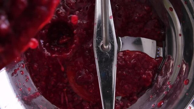 Rasberry Sauce Pouring into Food Mill