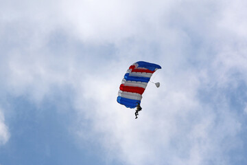 Skydiver flying wing in a blue sky	