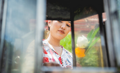 Beautiful Asian girl at big Buddhist temple dressed in traditional costume