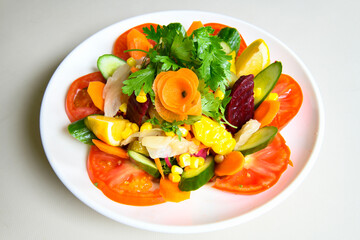 Green salad with arugula, lamb and tomatoes. Healthy vegan dish. Top view at table. Turkish Coban (choban) salata or Shepherds salad, Akdeniz salad in white bowl.