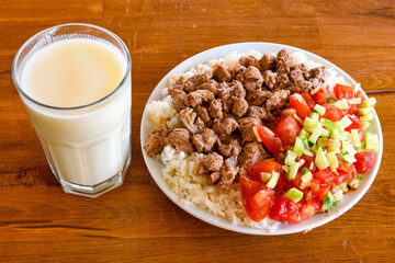 Beef steak grill with rice pilaf, fried potatoes, grilled pepper and tomatoes.Mix Platter with Beef rips, Cutlets, Potatoes and Sauces.