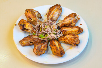 A skewered chicken kebob with grilled onions, bell peppers and delicious white meat with seasoning isolated on a white background. Tavuk sis, Tavuk izgara.