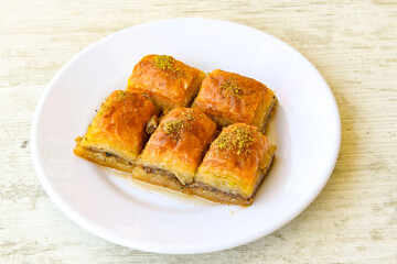 Turkish Dessert Sobiyet , havuc dilimi,  midye  Baklava, mussels baklava and classic baklava with Pistachio . Cevizli, Fistikli Baklava, top view.