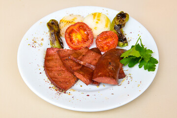 Grilled chili, tomato and sucuk between bread. ( Sucuk ekmek ) 