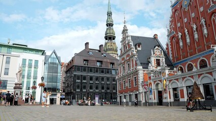Beautiful summer day in Riga. People and tourists exploring old town of Riga, Latvia.