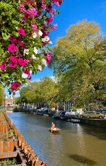 Naklejka premium Boating through Amsterdam Canals