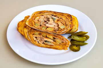 Lavash doner kebab ( zurna tavuk et doner durum )  or shawarma sliced in plate isolated. 