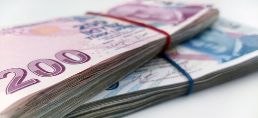    2 stacks of money on a white background       