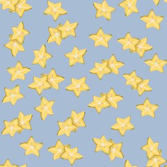 Surface pattern with Star fruit on a blue background.  Star fruit  texture seamless pattern print background.