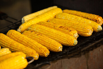 Fresh roasted or grilled corncobs. Grilled Corn for sale on the street.