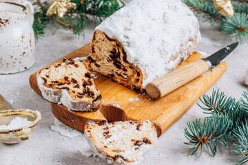 Traditional Christmass stollen on stone background.