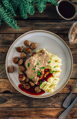 Swedish meatballs kottbullar, mashed potato, onion sauce and lingonberry sauce.