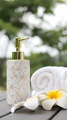 White towel rolls, spa concept, beautiful spa elements on the massage table in the wellness center.