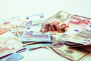 Cash on table isolated: dollars, euro, rubl broken money. All in mess, global crisis concept, dollar rules world