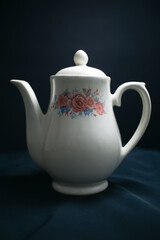 traditional teapot in black background display