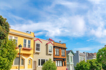 Two-storey townhomes exterior with colorful wall sidings in the suburbs of San Francisco, California