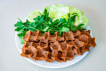Steak a la turca or chee kofta on a plate( Cig Kofte )  - Turkish Food.