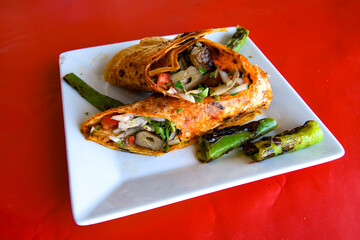 Lavash doner kebab ( zurna doner durum )  or shawarma sliced in plate isolated. 