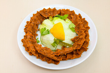 Steak a la turca or chee kofta on a plate( Cig Kofte )  - Turkish Food.