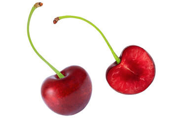 Cherries on an isolated white background. Whole and half cherries