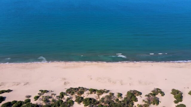 Aerial footage in Patara Beach longest sand beach in Turkey camera tilt up from sand beach to the sea and horizon (Patara is old city and Lycian Capital) no people summer sunny