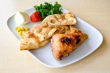 A skewered chicken kebob with grilled onions, bell peppers and delicious white meat with seasoning isolated on a white background. Tavuk sis, Tavuk izgara.