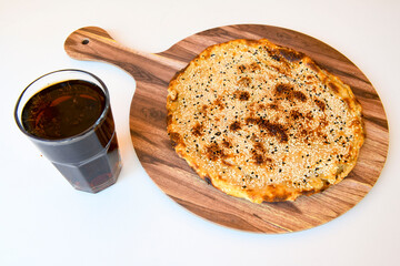 Freshly baked appetizing Turkish tortillas - Gozleme with spinach, cheese  on a wooden board. Space for text. Shallow depth of  field. Handmade Turkish traditional pastries.