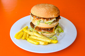 Big tasty  burger with beef cutlet on a plate. Hamburger.