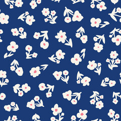 Fototapeta na wymiar Cute flowers with leaves seamless repeat pattern. Random placed, vector botany all over surface print on blue background.