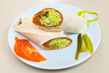 Traditional Turkish Raw Meat Wrap ( Turkish Name : Cig Kofte Durum ). Raw Meat in roll of bread lavash. Turkish food. 