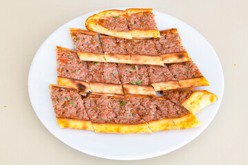 Turkish pita with minced cubed meat and cheese (Turkish name: Kiyma Kusbasi kasarli pide)