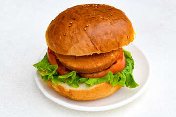Big tasty  burger with beef cutlet on a plate. Hamburger.